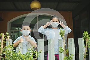 Asian children quarantine of corona virus , white infection of covid-19 disease photo