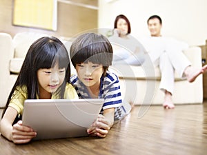 Asian children using digital tablet