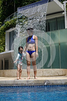 Asian chinese child hesitant to enter water