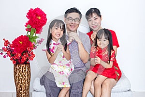 Asian Chinese family with greeting gesture celebrating for Chine