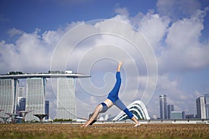 Asian Chinese Female Yogi outdoor yoga exercise under the sun