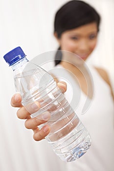 Asian Chinese Girl Holding Bottle of Pure Water