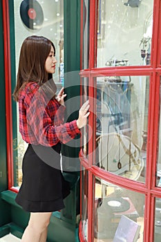 Asian chinese Girl near bookstore display window