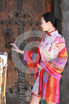 Asian Chinese girls wears cheongsam enjoy free time in ancient town