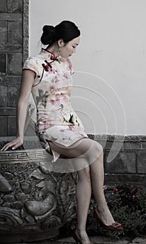 Asian Chinese girls wears cheongsam enjoy free time in ancient town photo