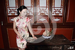 Asian Chinese girls wears cheongsam enjoy free time in ancient town photo