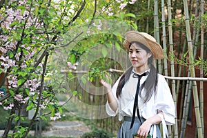 Asian Chinese Happy young cute adorable lovely student youth in a park garden outdoor in summer