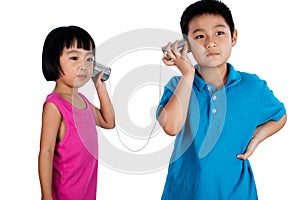 Asian Chinese Kid Playing with Tin Can Phone
