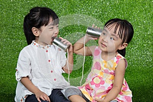 Asian Chinese Kids Playing with Tin Can Phone