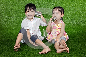 Asian Chinese Kids Playing with Tin Can Phone