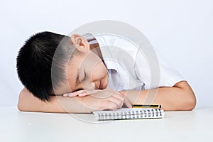 Asian Chinese Little Boy Wearing Student Uniform Sleeping on Desk