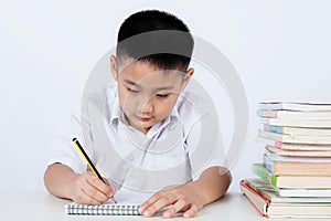 Asian Chinese Little Boy Wearing Student Uniform Writting Homework