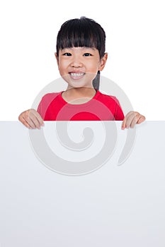 Asian Chinese little girl behind a blank white board