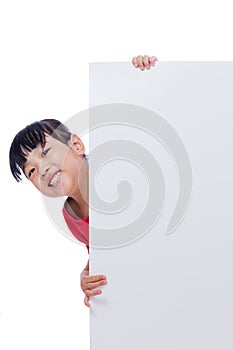 Asian Chinese little girl behind a blank white board