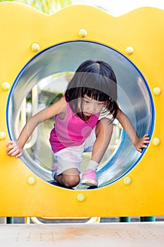 Asian Chinese little girl crawling at playground