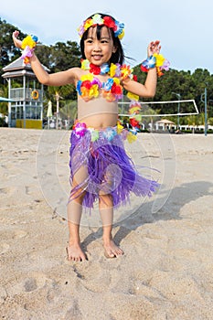 Asian Chinese little girl in hawaiian costume