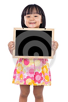Asian Chinese little girl holding blank blackboard