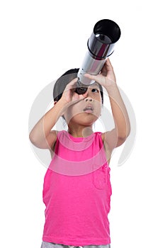 Asian Chinese little girl looking through a telescope