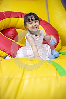 Asian Chinese little Girl Playing with Balls
