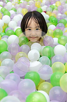 Asian Chinese little Girl Playing At Balls Pool