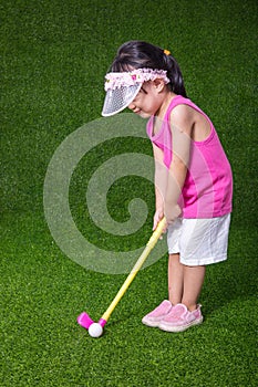Asian Chinese little girl playing golf