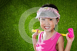 Asian Chinese little girl playing golf