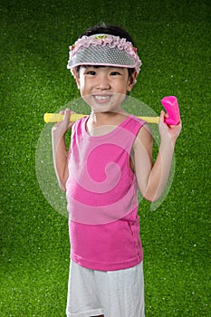 Asian Chinese little girl playing golf