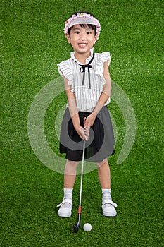 Asian Chinese little girl playing golf