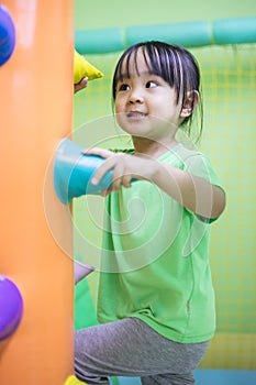 Asian Chinese little girl playing indoor