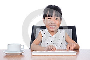 Asian Chinese little girl playing keyboard