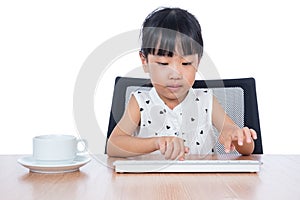 Asian Chinese little girl playing keyboard