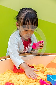 Asian Chinese Little Girl Playing Kinetic Sand