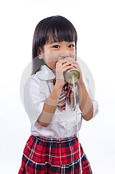 Asian Chinese little girl playing retro tin can phone