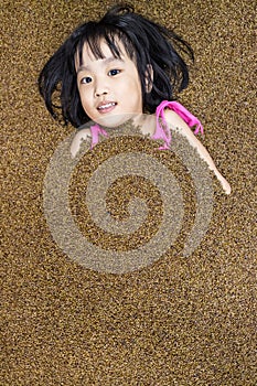 Asian Chinese Little Girl Playing with Sand