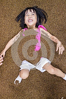 Asian Chinese Little Girl Playing with Sand