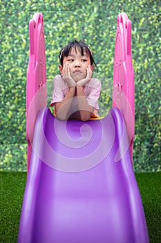 Asian Chinese Little Girl Playing on the slide