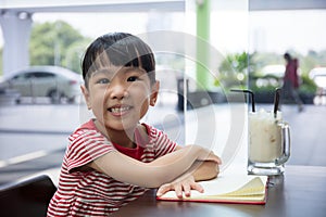 Asian Chinese little girl reading book