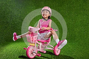 Asian Chinese little girl riding bicycle