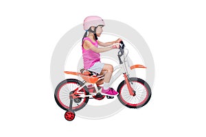 Asian Chinese little girl riding bicycle