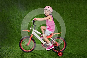 Asian Chinese little girl riding bicycle