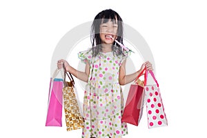 Asian chinese little girl with shopping bags