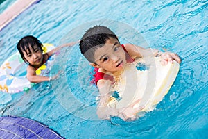 Asian Chinese Little Kids Playing in the Swimming Pool