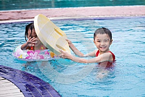 Asian Chinese Little Kids Playing in the Swimming Pool