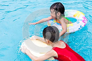 Asian Chinese Little Kids Playing in the Swimming Pool