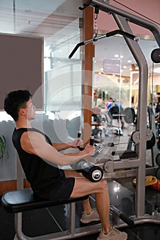 Asian chinese man in gym ï¼ŒFitness sport man lifts in the gym