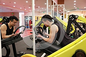 Asian chinese man in gym ï¼ŒFitness sport man Training strength in the gym