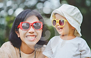 Asian Chinese Mother and little boy smiling outdoor