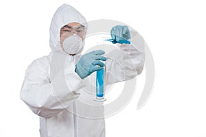 Asian Chinese scientist in protective wear holding test tube