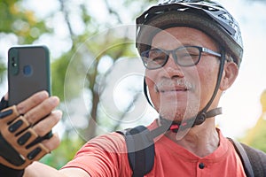 Asian Chinese Senior man taking selfie