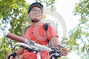 Asian Chinese Senior man travel with bicycle